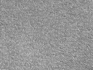 Capture the subtle beauty of this gray knitted fabric, perfect for adding depth to any project. Its fine texture and soft tones create a versatile and inviting background element that offers warmth. © Pernandi Imanuddin