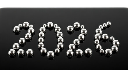 2026 formed with metallic spheres on glossy black surface, creating striking visual contrast