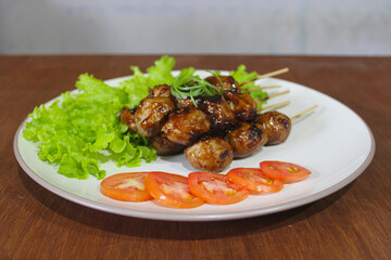 Indonesian Bakso Bakar Skewers on White Plate