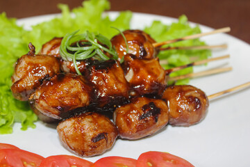 Extreme Close-up of Glossy Indonesian Bakso Bakar