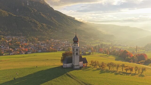 Aerial of alpine church Chiesa di San Valentino, Seis am Schlern.