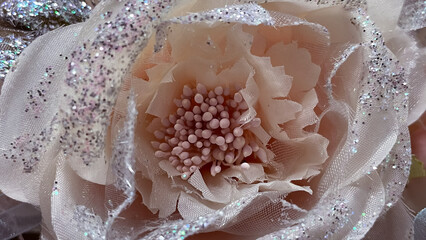 Soft pink and silver glitter flower macro. Elegant textile wedding/holiday decoration background