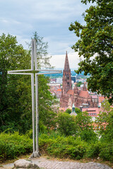Fototapeta premium Germany, Aerial panorama view of freiburg im breisgau city minster cathedral in historical old town next to cross