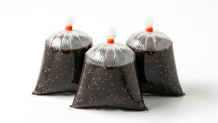 Three Bags of Dark Liquid on a White Background.