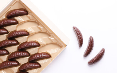 Box of chocolate candies on white background. Top view
