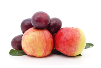 Fresh apples and plums isolated on white background.