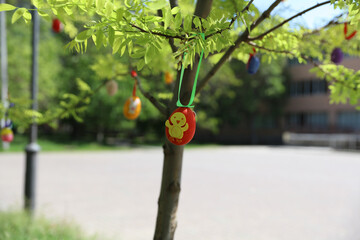 Easter eggs kids crafts hanging on tree branch