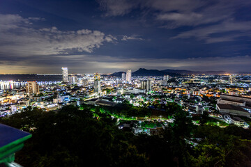 Panoramic nature background (mountains, sea, trees, twilight lights in the sky, waterfront communities), naturally blurred through the wind, seen on tourist spots or scenic spots
