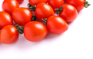 Ripe cherry tomatoes on a white background. Copy space
