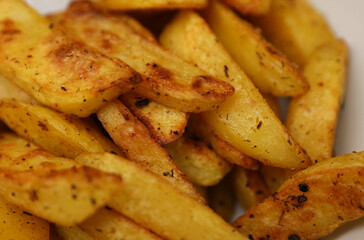 Fried potatoes peasant style on a plate