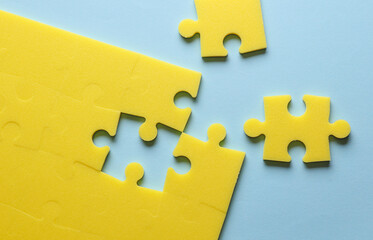 Fototapeta premium Yellow puzzle pieces. Teamwork, business concept