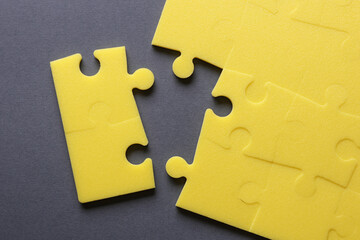 Fototapeta premium Yellow puzzle pieces. Teamwork, business concept