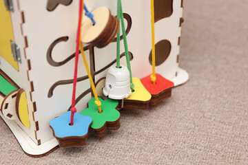 Wooden cube for developing motor skills of small children