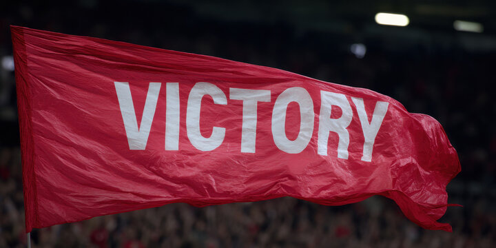 Victory banner red flag bold text stadium crowd celebration energy waves ripple with joy