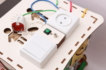 Wooden cube for developing motor skills of small children