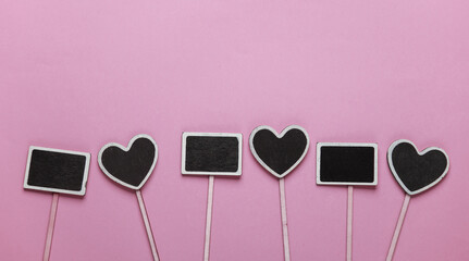 Chalkboard labels, blank wooden blackboard tags, garden sign on pink background