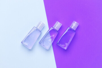 Antiseptic bottles on a colored background