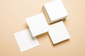 Composition of floating white square memo papers on yellow background. Business concept