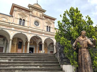 Obraz premium Francis of Assisi sculpture in front of a church in Locarno in Switzerland