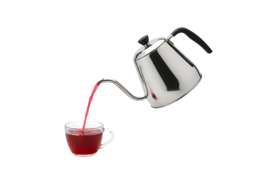 A tea kettle pouring red tea against a white backdrop

