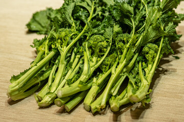 Cime di rapa, turnip greens, rapini or broccoli rabe in a street food market, green cruciferous vegetable, veggies, mediterranean cuisine, Puglia, Italy