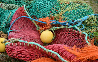 Multicolored green red fishing nets in the port