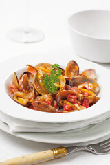 A dish of clams with bacon and vegetables. Cataplana, a typical recipe from the Algarve, Portugal.