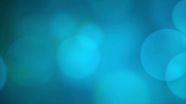 abstract teal and cyan blurred bokeh lights slowly fading and shifting background loop