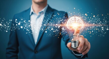A man in a suit holding a light bulb with a brain inside, against a blue background with glowing particles.