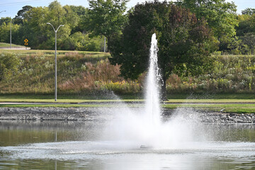 Naklejka premium Fountain in the Pond