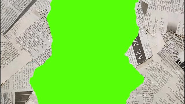Close up shot of torn newspaper pieces with green screen elements overlayed