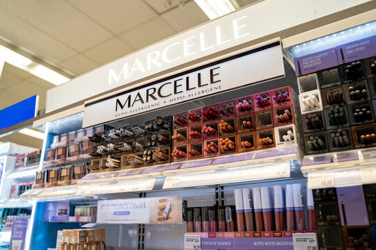 View of Marcelle makeup display with lip and eye products in store. Toronto, Canada - November 20, 2025.