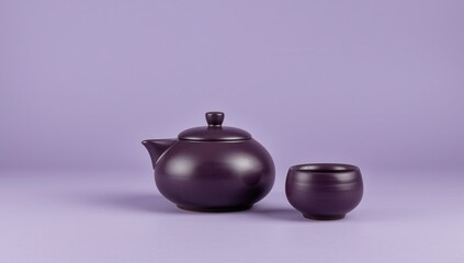 Elegant purple tea set featuring a teapot and cup, perfect for a calming tea ceremony