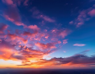 Obraz premium a stunning sky at dawn and dusk with vibrant hues of gold pink blue and more clouds paint the twilight morning and evening sky creating a scenic cloudy copy space image