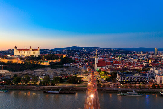 View of Bratislava castle, old town and the Danube river from observation deck the bridge in Bratislava, Slovakia at night