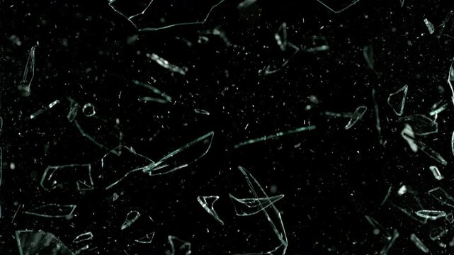 Super Slow Motion Shot of Real Glass Break at 1000 fps Isolated on Black Background.