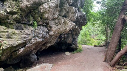 ​Large rock cave near path