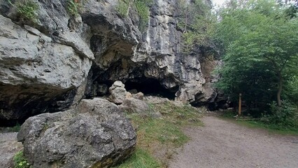 ​Large rock cave near path