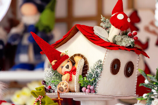 Felt Christmas decorations with teddy bear in snow house