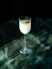 Stylish cocktail with citrus slice on a marble surface