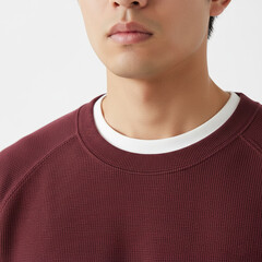 Detail of man wearing burgundy long sleeve with white undershirt