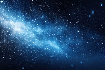 Obraz premium Majestic winter night sky filled with glowing particles, deep azure background, ideal for captivating holiday-themed graphics and banners