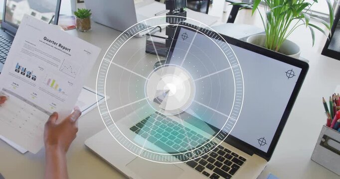 Woman lifting hand from pad, grabbing Qtr Report, reading business charts while HUD circling graphs