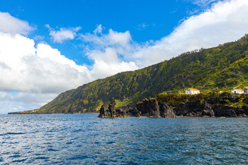 Atlantic ocean coast the houses on the cliff at Azores Portugal © Natalia