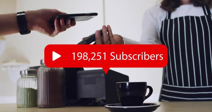 Woman tapping phone at POS in cafe, subs count above cup updating to 1,000,000 celebrating lifting