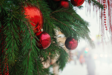 Festive pine tree decoration captured with a cozy, bokeh-filled Christmas background.