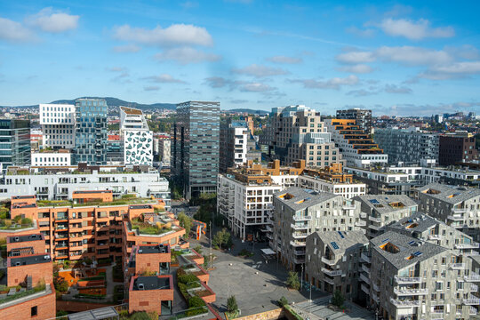 Architecture cityscape in Oslo highlighting Barcode daytime waterfront housing buildings and rooftops expanding into a spacious modern urban landscape.