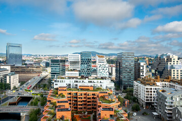 Architecture cityscape of Barcode Oslo during daytime showing housing waterfront buildings and rooftops creating an organized urban area suitable for modern themes.