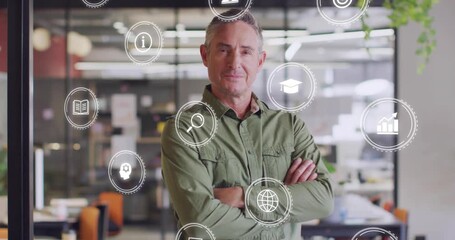 Man standing in office on play causing globe laptop chart orbiting torso, showing business skills