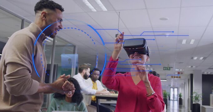 Female coworker wearing VR headset raising hands and initiating blue HUD expanding for team demo